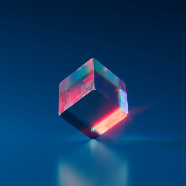 A glass cube standing on one of its corners.